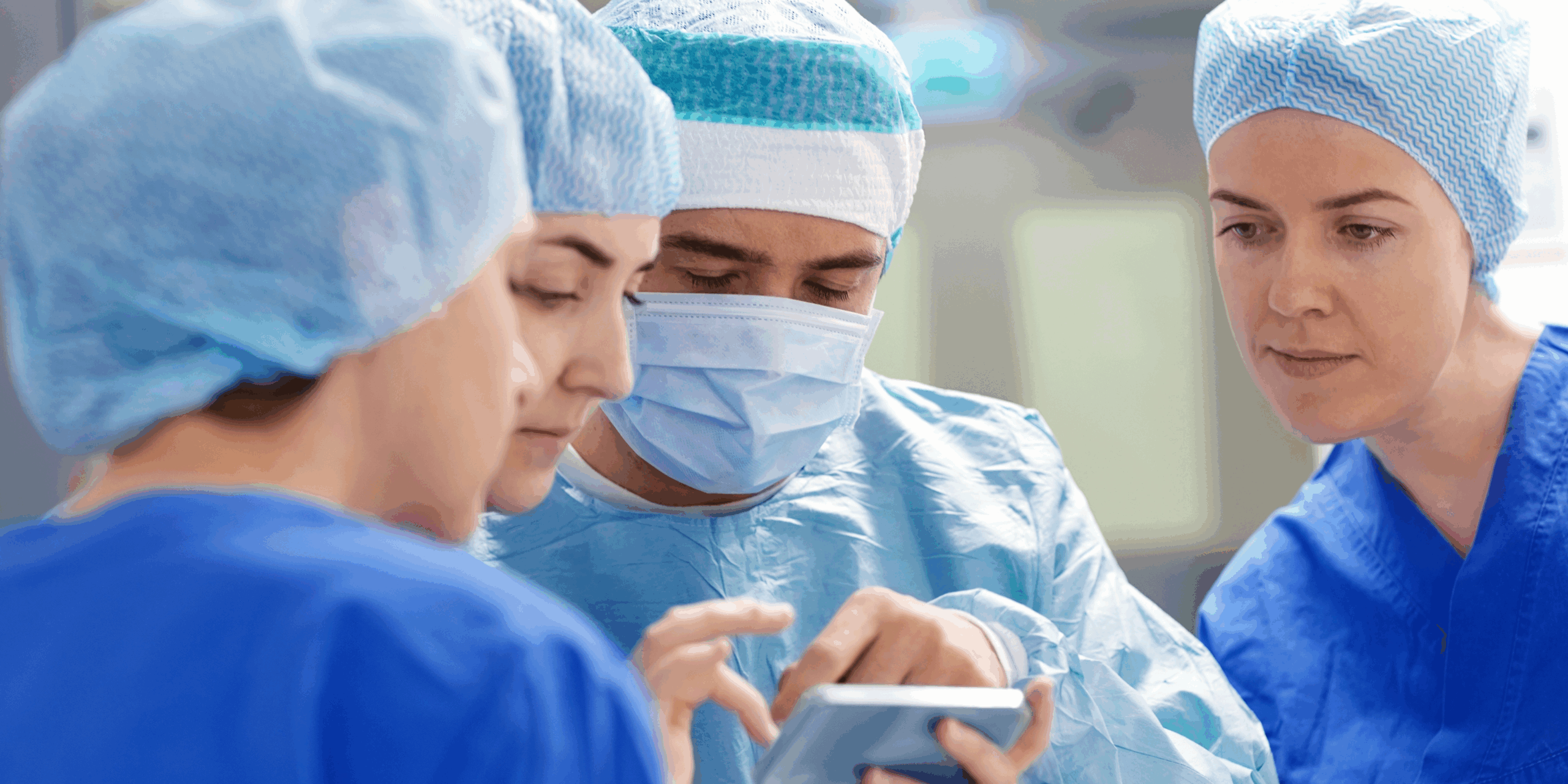 Photograph of four surgeons in the operating room.